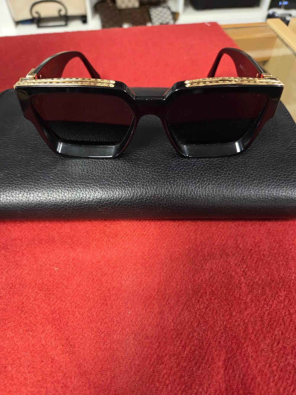 Louis Vitton Black framed gold trim Sunglasses